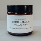 Jar of Juniper + Orange Tallow Whip from Wild Roots Tallow Co. on a neutral background