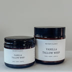 Two jars of Vanilla Tallow Whip on a white surface with a neutral background