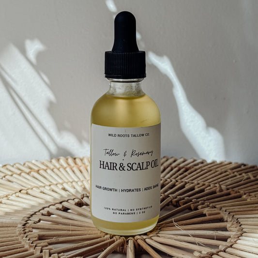 Bottle of hair and scalp oil on a woven surface with a neutral background